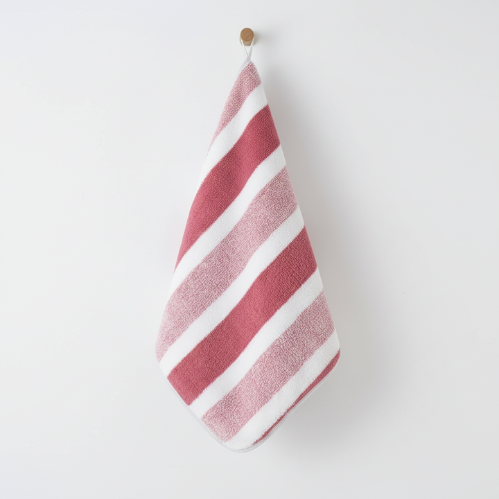 Luxurious striped coral fleece hand towels & washcloths, soft, quick-drying.
