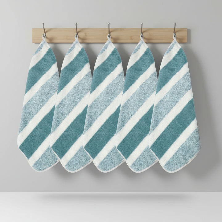 Absorbent soft coral fleece towel set with elegant stripes, bathroom essential.