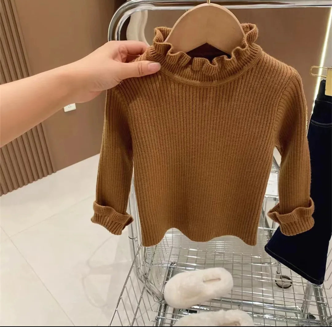 Smiling toddler in a soft, cozy long-sleeve sweater, perfect for comfortable autumn & winter kids' playwear and everyday wear.