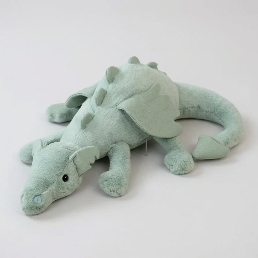 Soft, cuddly green dragon plush toy with wings, perfect for kids' imaginative play and comfort.