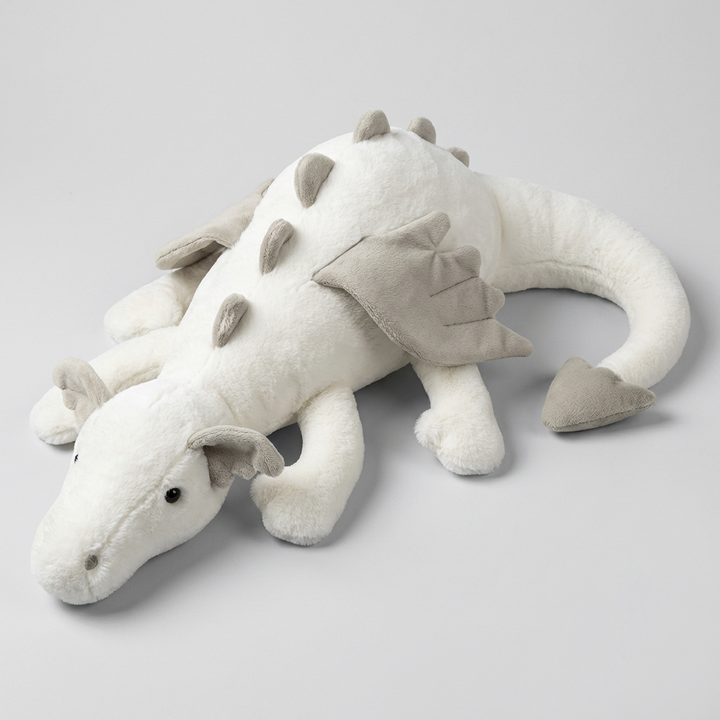 Cute dragon plush toy with soft wings, a cuddly fantasy stuffed animal designed for kids' comfort and play.