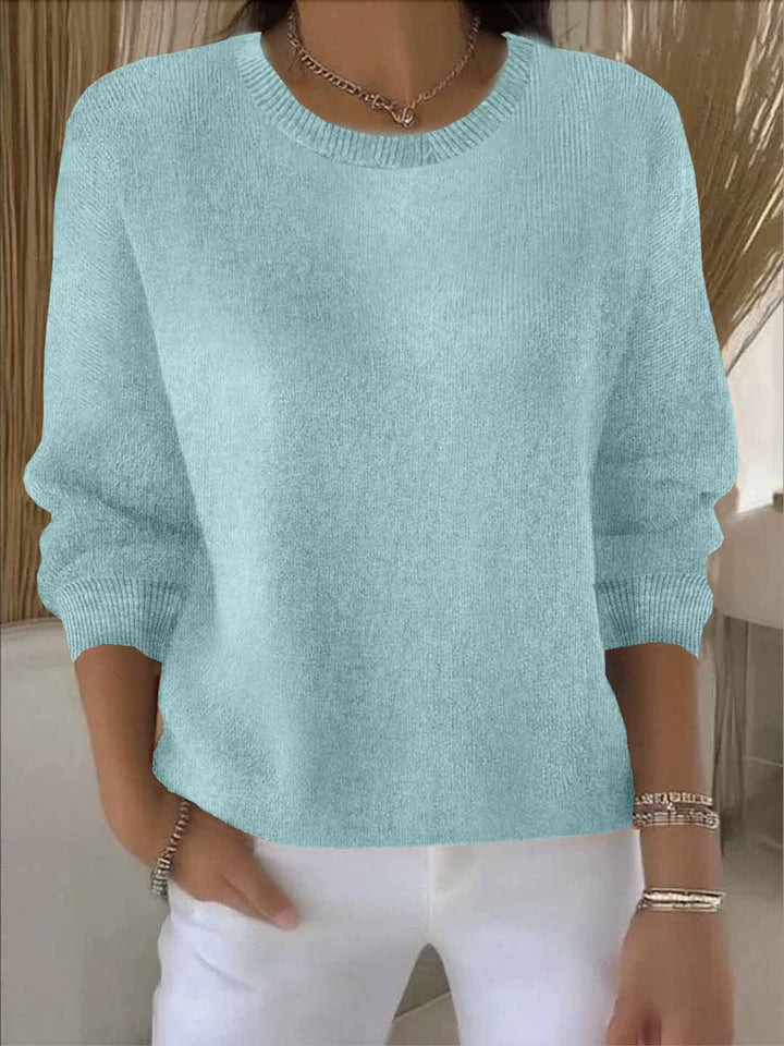 Relaxed fit women's sweater, cozy knit for versatile fall layering.