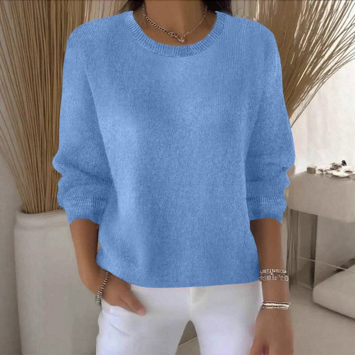 Cozy women's winter sweater, soft knit with a relaxed, flowy fit.