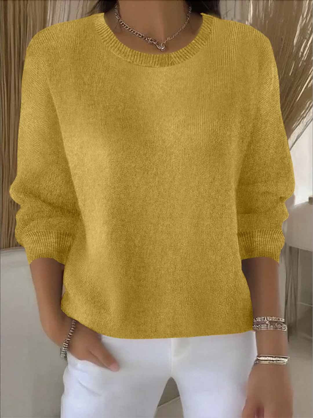 Chic women's fall/winter sweater, cozy knit for relaxed layering.