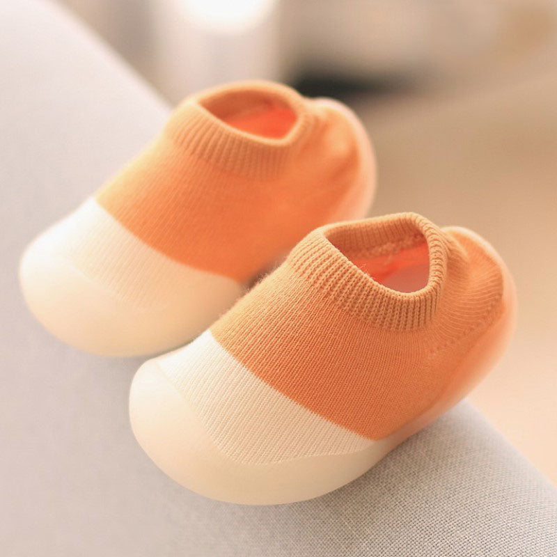 Soft knitted infant anti-slip booties, designed for warmth, comfort, and safe first steps.