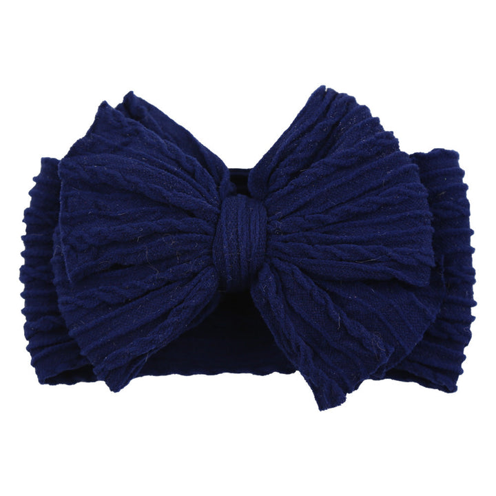 Infant girl's soft nylon headband with a cute stylish bow for daily wear.