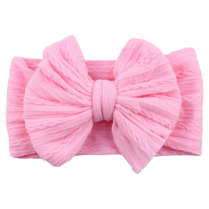 Toddler girl's comfortable stretchy nylon headband with a stylish bow.