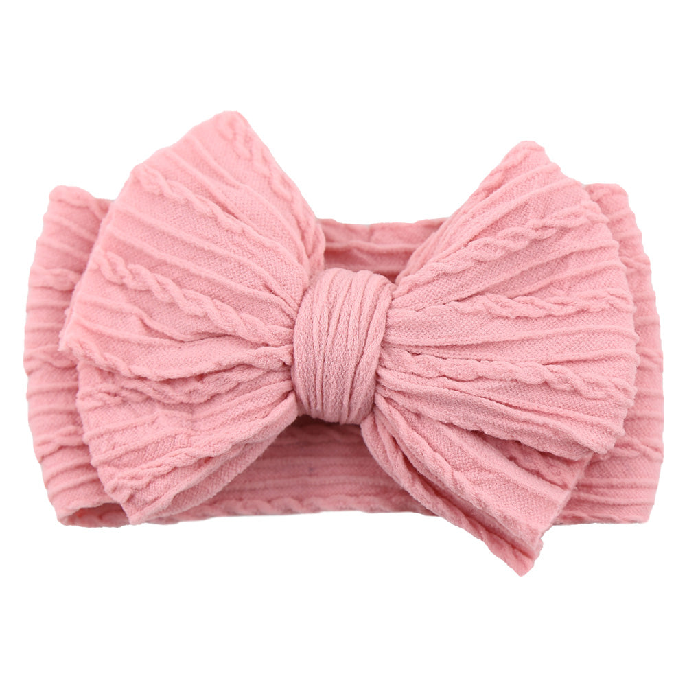 Stylish baby girl gift: soft nylon headband with a chic bow, a lovely child hair accessory.
