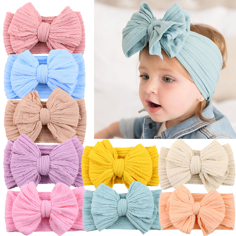 Comfortable, stretchy nylon headband with a stylish bow for toddler girls.