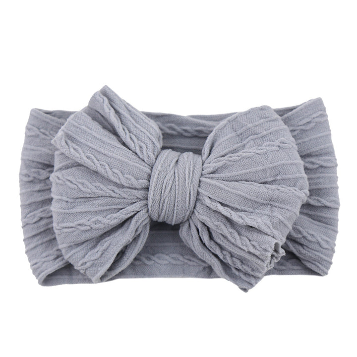 Trendy children's fashion accessory: soft nylon headband with an elegant bow.