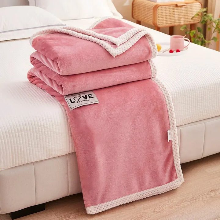 BlushCozy pink flannel fleece blanket, a soft decorative throw for cozy comfort and stylish home decor.