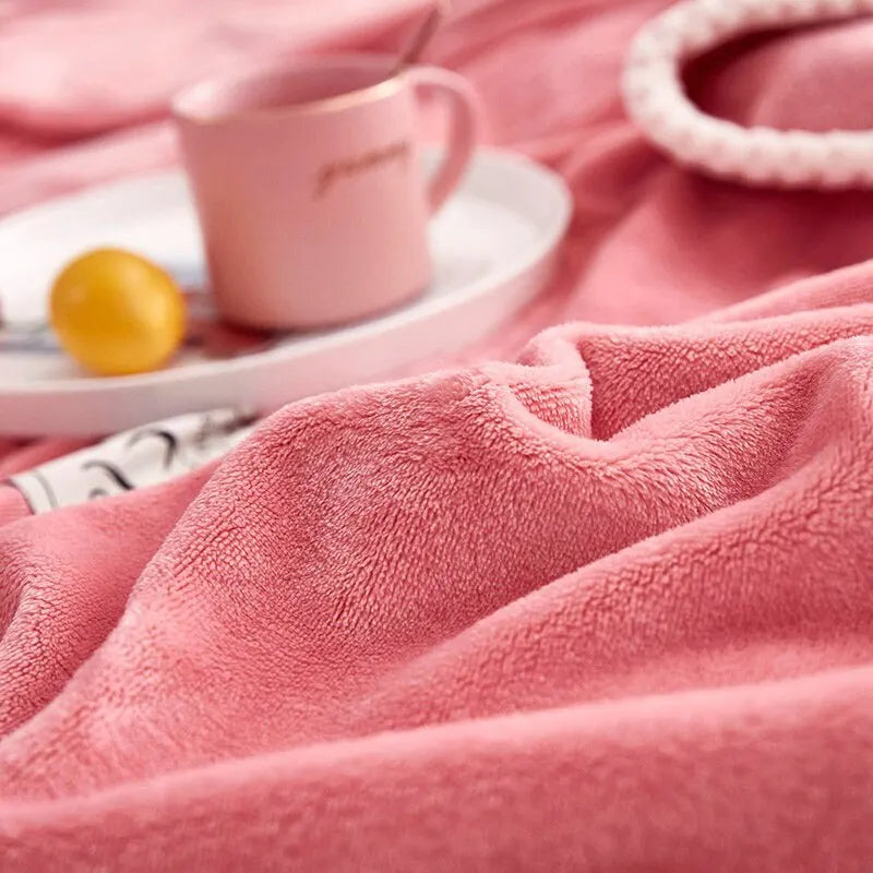 Comfortable pink flannel fleece blanket by BlushCozy, offering soft warmth and cozy style for home decor.