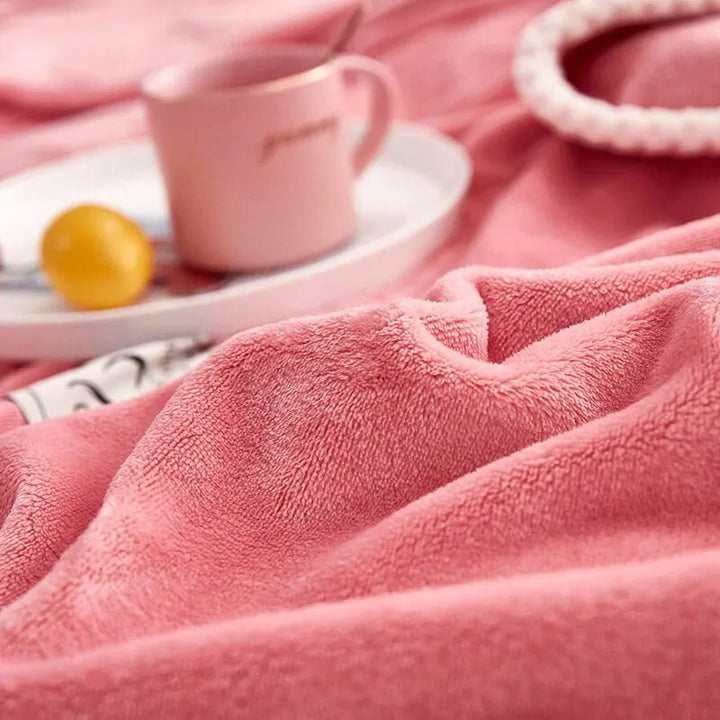 Comfortable pink flannel fleece blanket by BlushCozy, offering soft warmth and cozy style for home decor.
