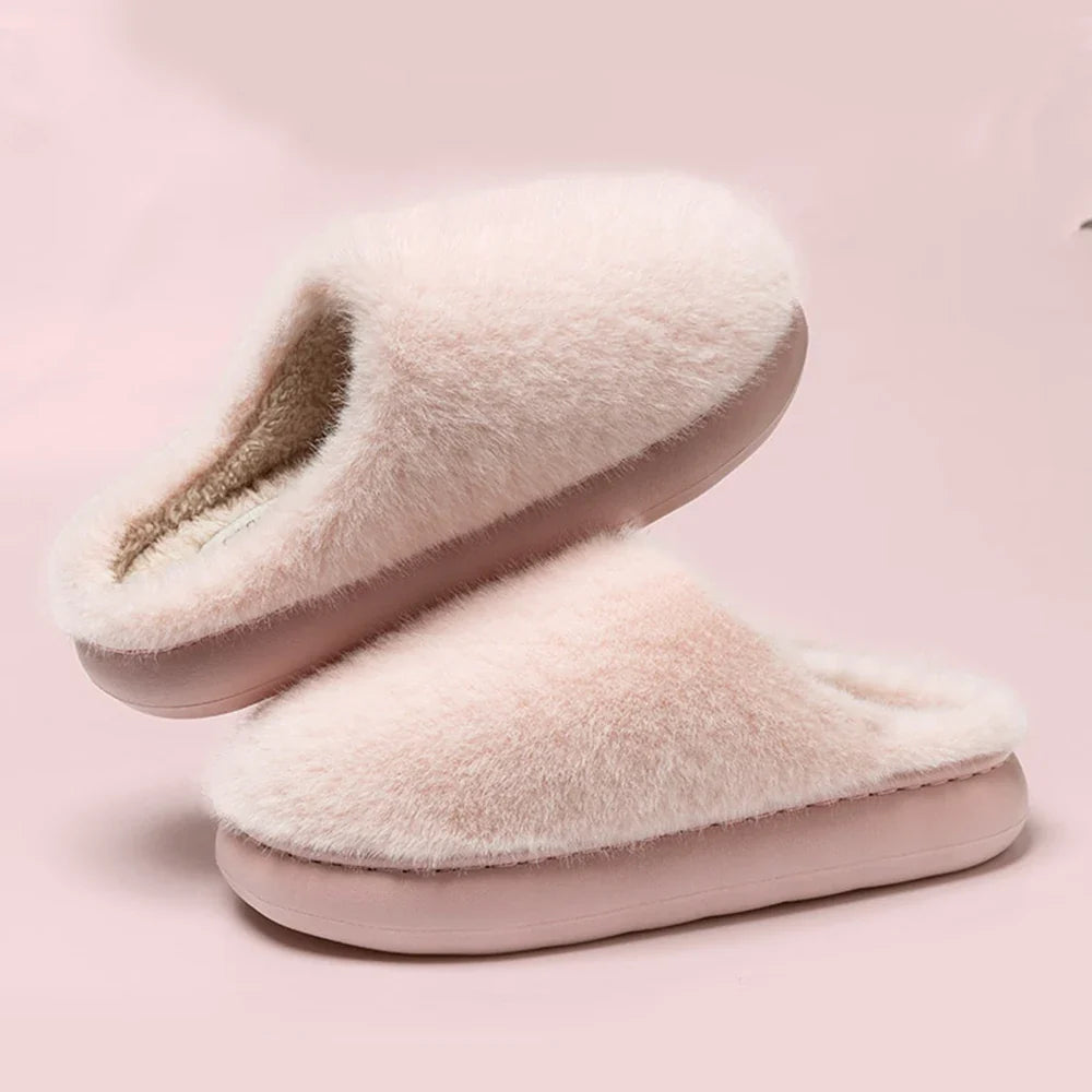 Soft pink plush women's slippers, ultimate comfort house shoes for indoor warmth & relaxation at home.