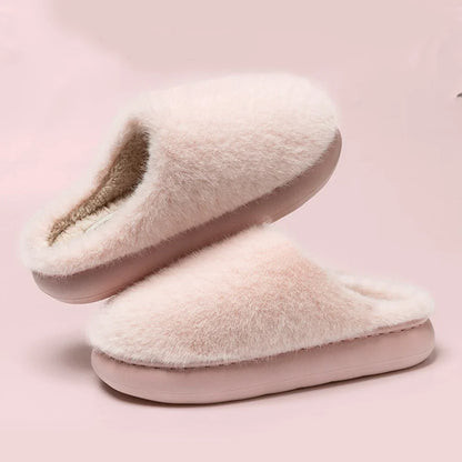 Soft pink plush women's slippers, ultimate comfort house shoes for indoor warmth & relaxation at home.