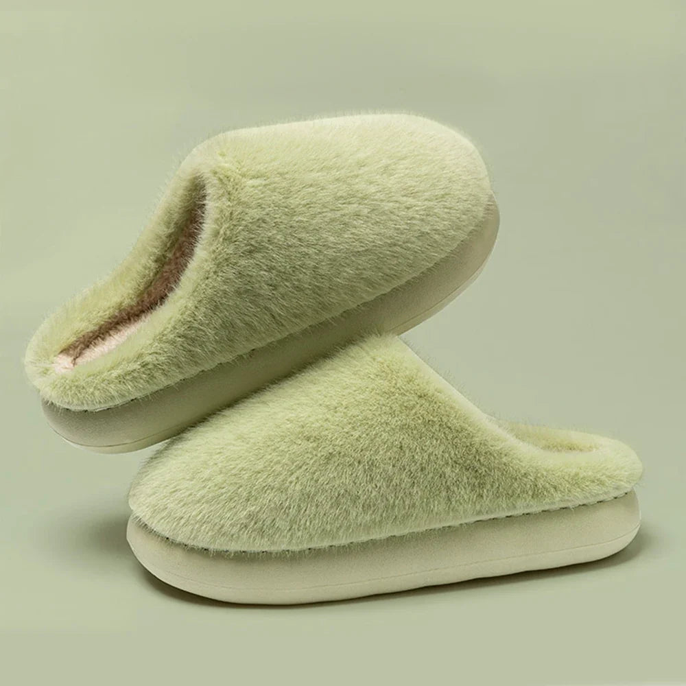 Pair of cozy women's plush slippers in a beige color, soft indoor footwear for ultimate home comfort.