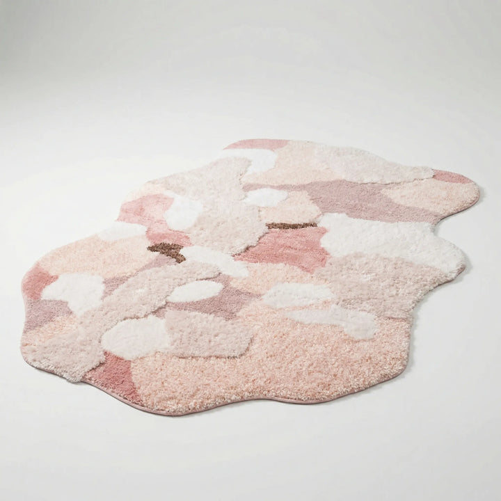 Plush Flowique sculpted area rug featuring elegant wave patterns, a cozy and soft statement piece for home decor.