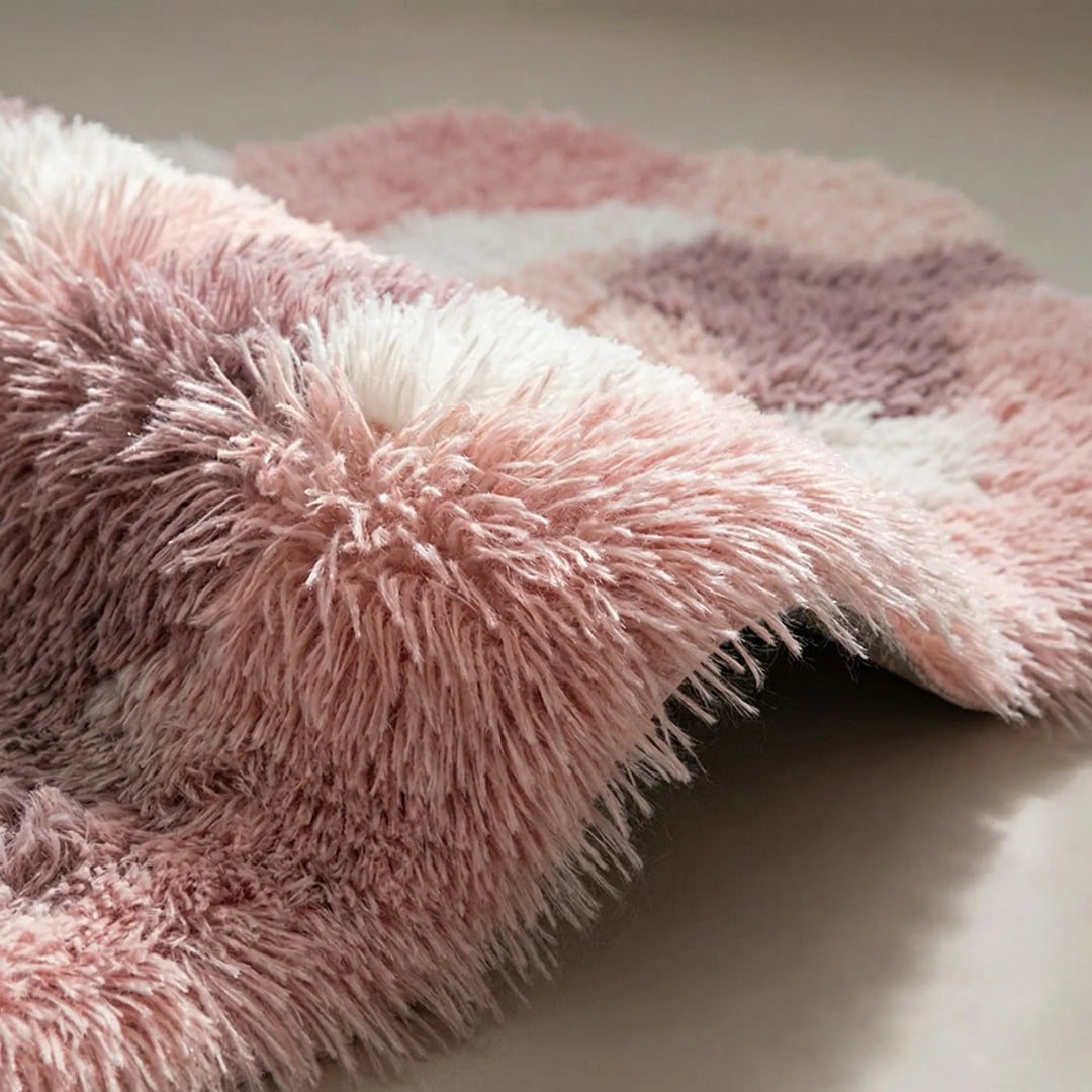 Nature-inspired sculpted area rug with soft waves, offering plush comfort and serene organic design for any room.