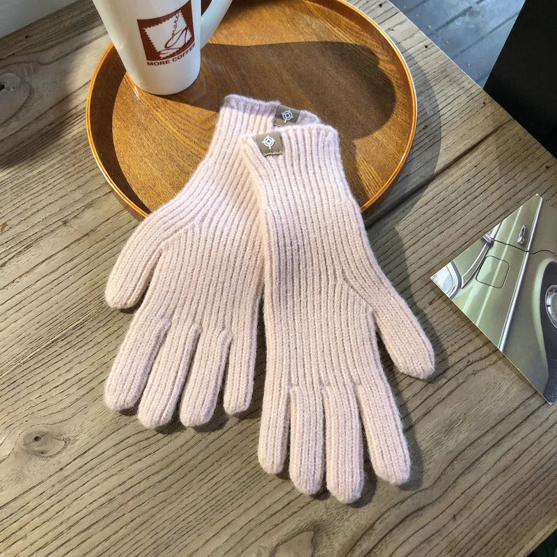 Stylish women's winter gloves, soft, warm, and touchscreen compatible. Essential cold weather accessory.