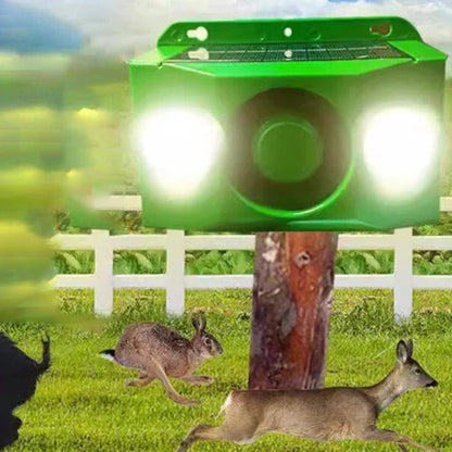 Outdoor solar animal repellent with flashing light & loud alarm. Wildlife deterrent & garden security.