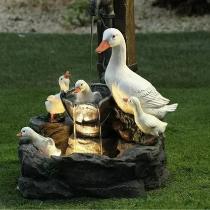 Patio accent: solar garden fountain with LED light & cute animal figurine. Creates a serene outdoor oasis.