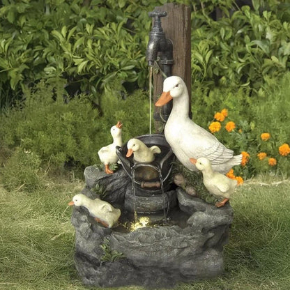 Outdoor solar fountain with integrated LED light & charming animal figurine. Ideal garden or balcony decor.