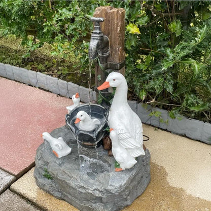 Decorative solar garden fountain with LED light and an animal statue. Enhance your patio & outdoor space.