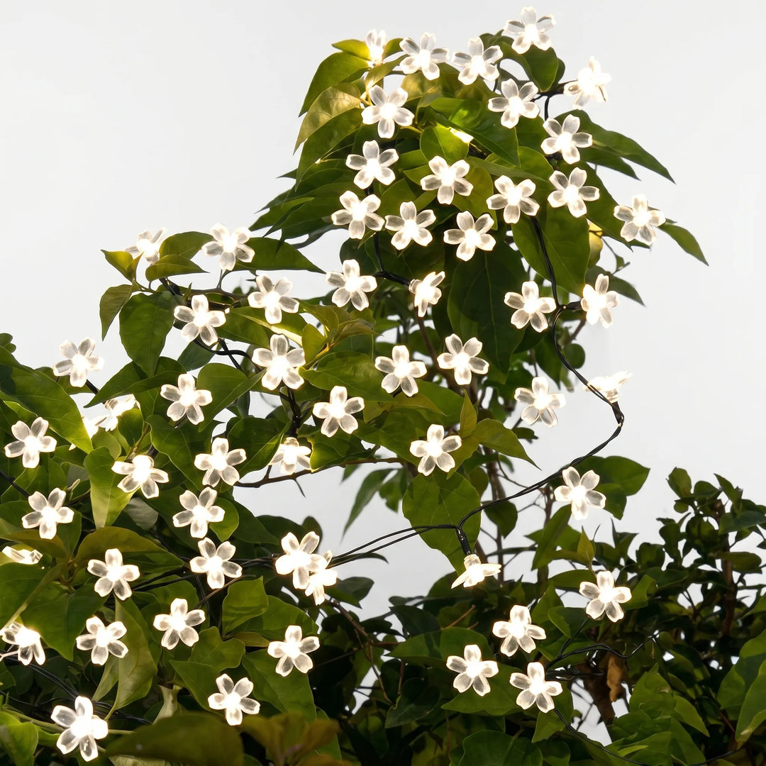 Waterproof solar LED flower string lights, ideal for patio lighting & garden party decorations.