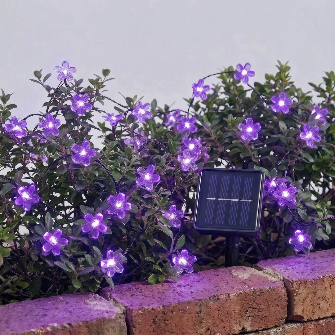 Bright solar LED flower string lights, perfect for garden, patio, or fence line decor.