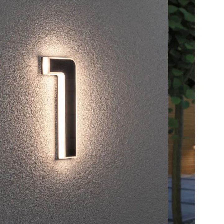 Weatherproof solar illuminated house number for modern home exteriors, enhancing curb appeal.