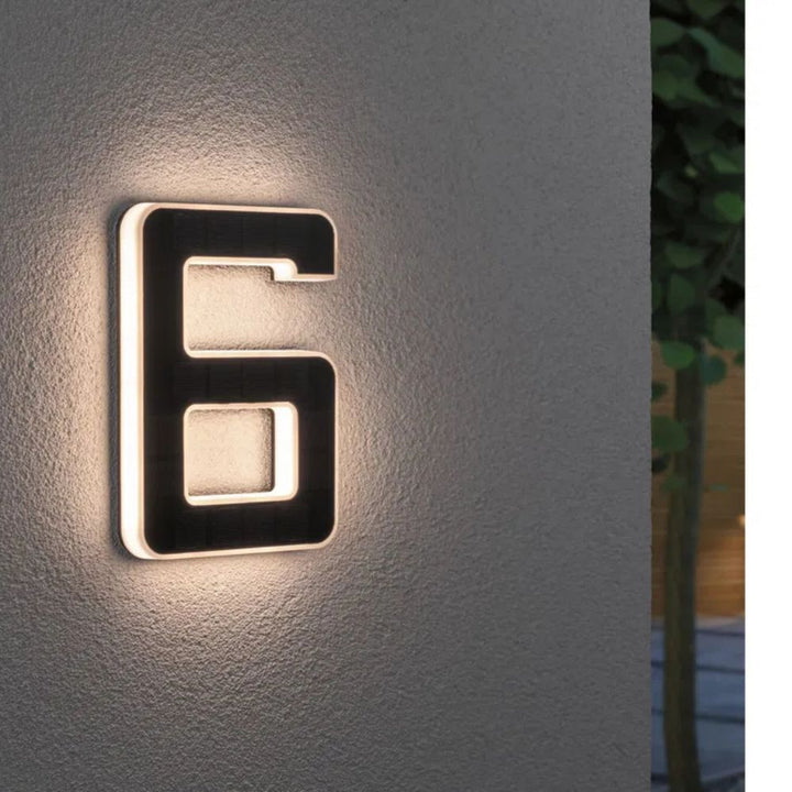 Easy-install solar LED house number, improving night visibility & home exterior aesthetics.