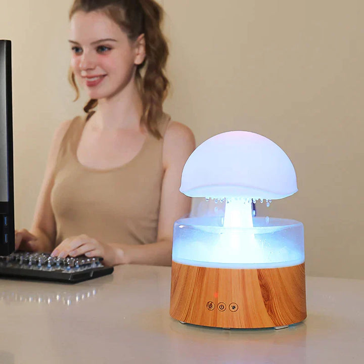 Elegant mushroom cloud rain diffuser & humidifier with colorful LED light. Ideal for home decor & peaceful ambiance.