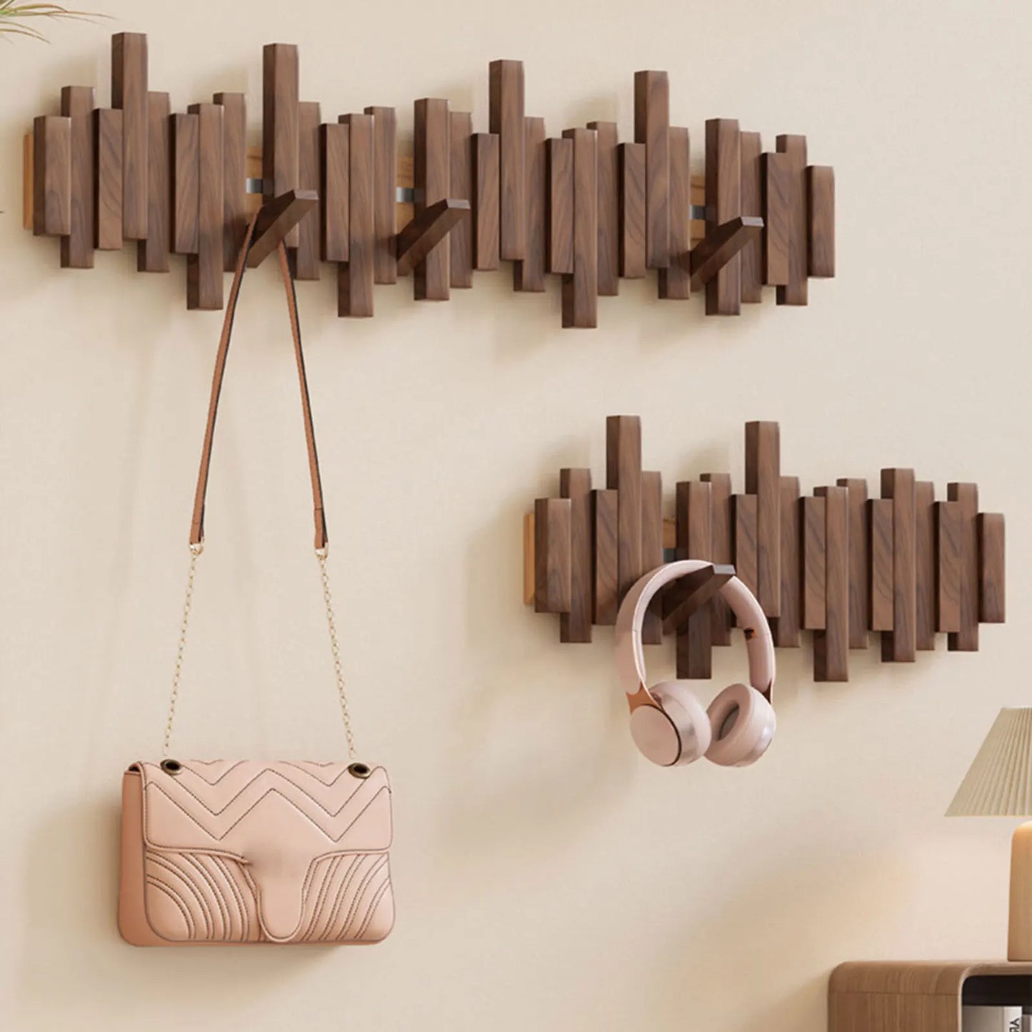 Efficient space-saving wall mounted coat rack. Features smart foldable hooks for a tidy entryway and home decor.