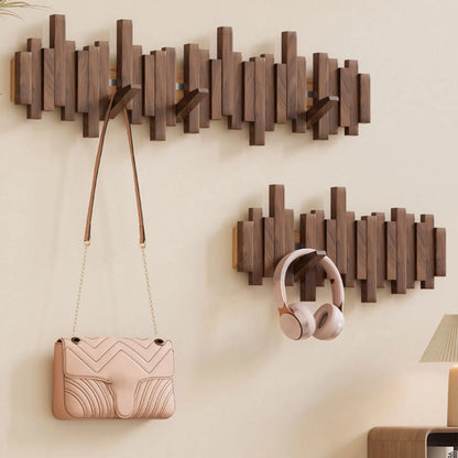 Efficient space-saving wall mounted coat rack. Features smart foldable hooks for a tidy entryway and home decor.