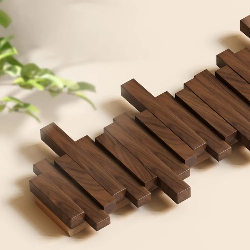 Modern natural wood wall hanger with retractable utility hooks. Perfect space-saving entryway organizer.