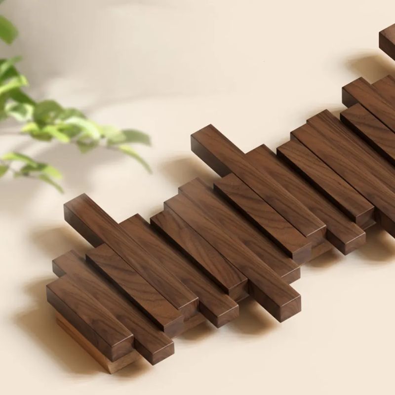 Minimalist natural wood coat rack with space-saving foldable hooks. Enhances any entryway home decor.