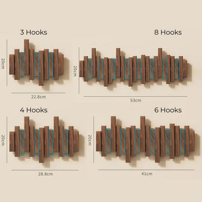 Wall mounted coat rack with unique foldable hooks. This wooden space-saving hanger organizes your entryway.