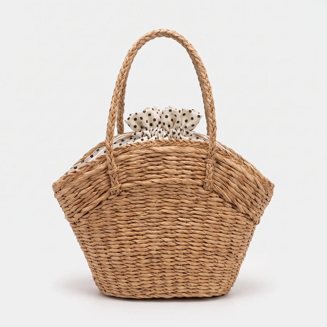 Stylish women's beige summer tote, a spacious and casual shoulder bag, perfect for beach days or a daily carry-all.