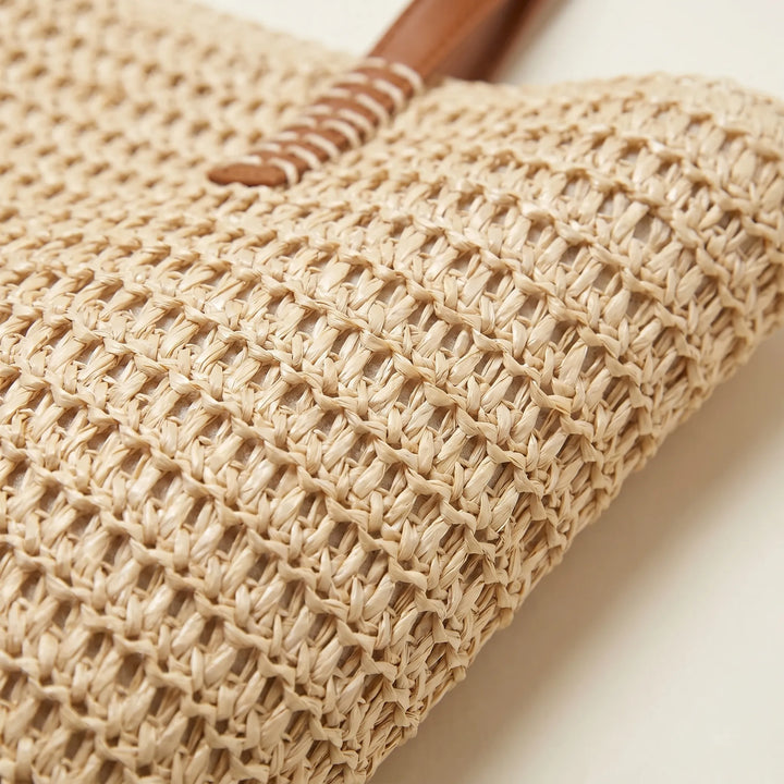 Large women's woven shoulder tote bag. A spacious and casual summer accessory for the beach or everyday essentials.