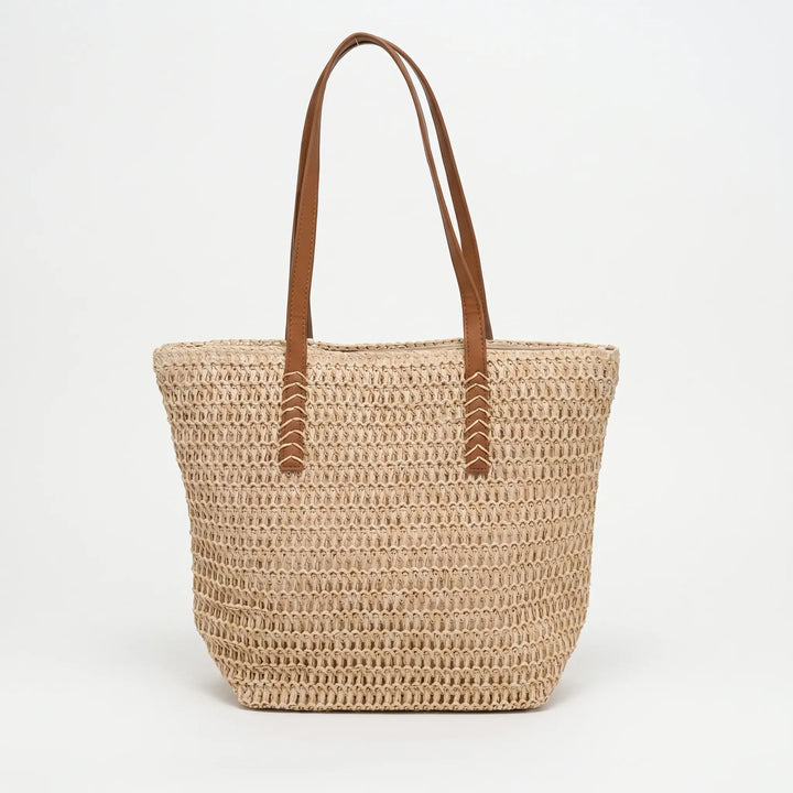 Elegant women's woven beach tote bag, spacious and durable, perfect for carrying all your summer essentials in style.
