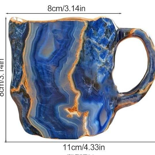 Deep volcanic red obsidian crystal coffee mug, unique handcrafted design for bold sips & modern decor.