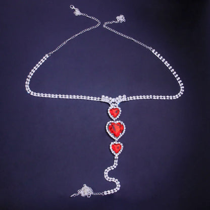 Elegant women's red heart rhinestone body chain, a luxurious and sparkling fashion jewelry accessory.