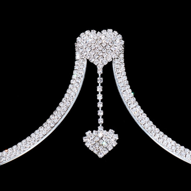 Intricate women's rhinestone chest pendant necklace. Shimmering jewelry accessory adding glamour to any outfit.
