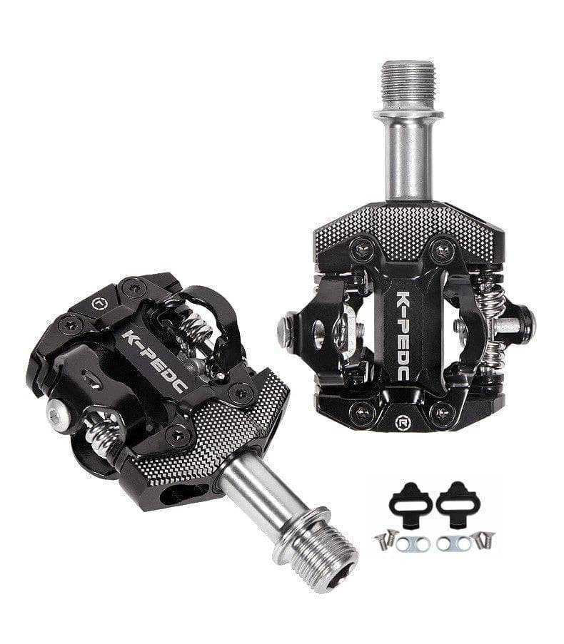 Hand holding an SPD bike pedal, illustrating its compact and sturdy design for enhanced cycling