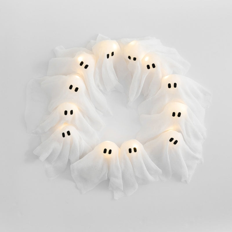 Haunted Halloween wreath featuring multiple white glowing ghost figures with bright LED lights.
