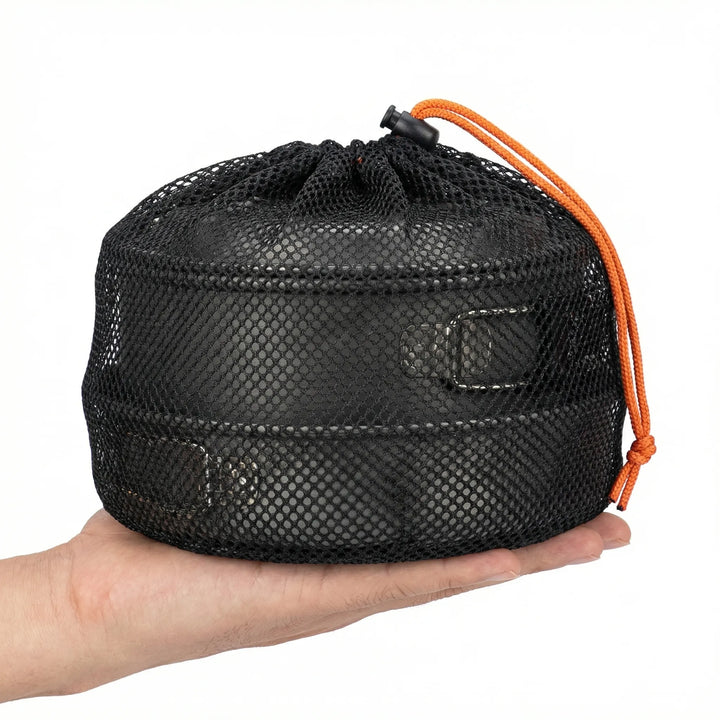 Nesting camping pot set with frying pan for outdoor cooking, suitable for camp stove use.