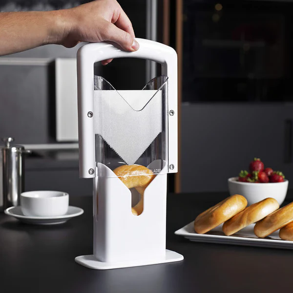 Guillotine-style stainless steel bagel cutter for perfectly sliced bagels, ideal for home kitchens & bakeries.