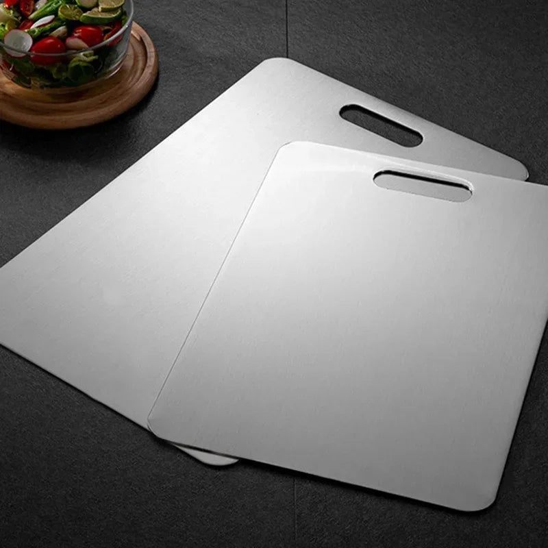 Stainless steel cutting board for hygienic food prep. Durable, non-porous surface, perfect for home chefs.