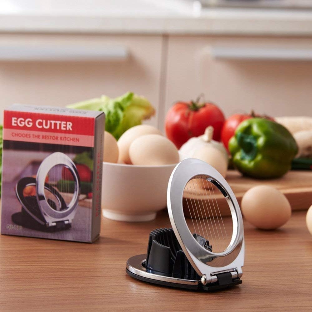 Ergonomic stainless steel egg slicer for uniform slices. A versatile kitchen gadget for eggs, fruits, veggies.