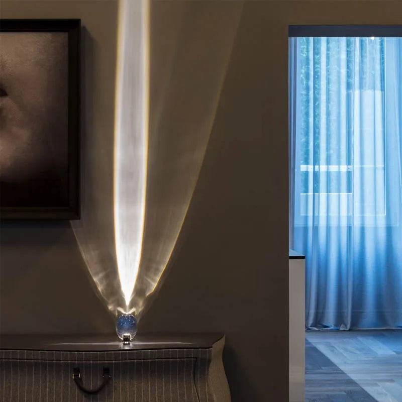 Enchanting Crystal Eye Night Lamp from StarGlow, casting a mesmerizing star projector effect on a wall.